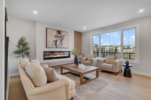 28 Spring Creek Point Sw, Calgary, AB - Indoor Photo Showing Living Room With Fireplace