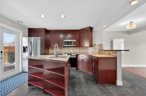 132 Erin Grove Close Se, Calgary, AB - Indoor Photo Showing Kitchen With Stainless Steel Kitchen With Upgraded Kitchen
