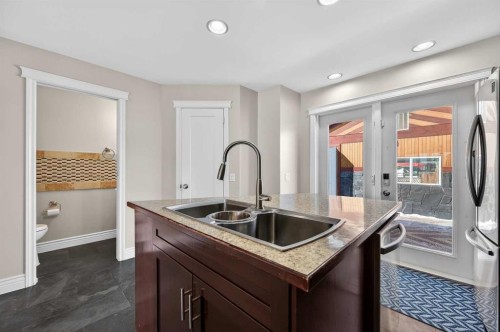 132 Erin Grove Close Se, Calgary, AB - Indoor Photo Showing Kitchen With Double Sink With Upgraded Kitchen