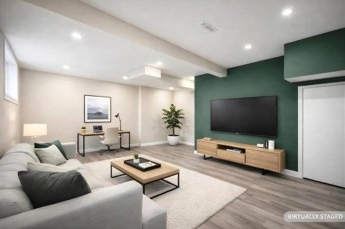 132 Erin Grove Close Se, Calgary, AB - Indoor Photo Showing Living Room