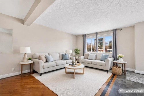 132 Erin Grove Close Se, Calgary, AB - Indoor Photo Showing Living Room