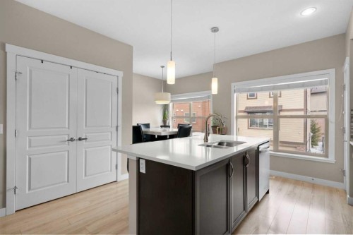 603-32 Horseshoe Crescent, Cochrane, AB - Indoor Photo Showing Kitchen With Double Sink