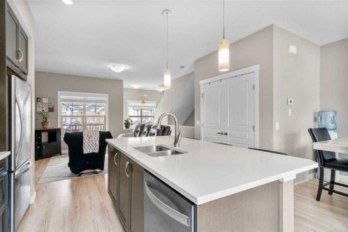 603-32 Horseshoe Crescent, Cochrane, AB - Indoor Photo Showing Kitchen With Double Sink With Upgraded Kitchen
