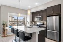 603-32 Horseshoe Crescent, Cochrane, AB  - Indoor Photo Showing Kitchen With Stainless Steel Kitchen With Double Sink With Upgraded Kitchen 
