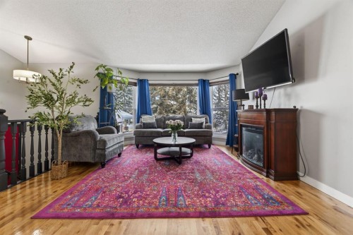 57 Shannon Circle Sw, Calgary, AB - Indoor Photo Showing Living Room With Fireplace