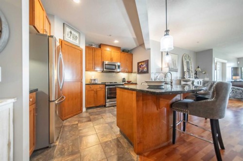 205-4 Hemlock Crescent Sw, Calgary, AB - Indoor Photo Showing Kitchen With Stainless Steel Kitchen