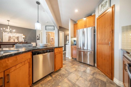 205-4 Hemlock Crescent Sw, Calgary, AB - Indoor Photo Showing Kitchen With Stainless Steel Kitchen