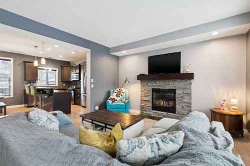 231 Prestwick Point Se, Calgary, AB - Indoor Photo Showing Living Room With Fireplace