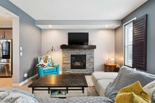 231 Prestwick Point Se, Calgary, AB - Indoor Photo Showing Living Room With Fireplace