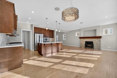 182 Cranarch Place Se, Calgary, AB - Indoor Photo Showing Kitchen With Fireplace
