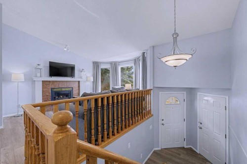 24 Sunlake Circle Se, Calgary, AB - Indoor Photo Showing Other Room With Fireplace
