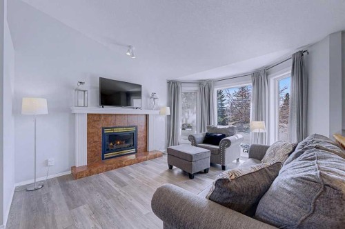 24 Sunlake Circle Se, Calgary, AB - Indoor Photo Showing Living Room With Fireplace