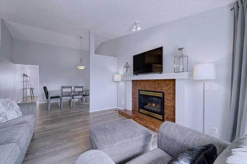 24 Sunlake Circle Se, Calgary, AB - Indoor Photo Showing Living Room With Fireplace