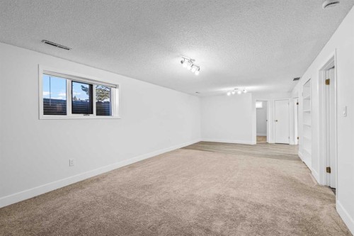 1007 Hunterston Place Nw, Calgary, AB - Indoor Photo Showing Other Room
