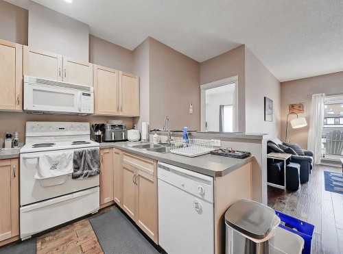 2313-70 Panamount Drive Nw, Calgary, AB - Indoor Photo Showing Kitchen With Double Sink