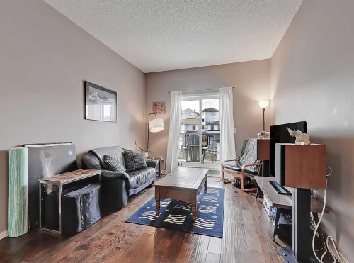 2313-70 Panamount Drive Nw, Calgary, AB - Indoor Photo Showing Living Room