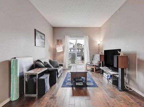 2313-70 Panamount Drive Nw, Calgary, AB - Indoor Photo Showing Living Room