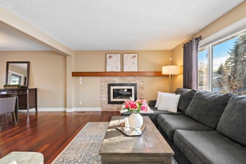 612 Willoughby Crescent Se, Calgary, AB - Indoor Photo Showing Living Room With Fireplace