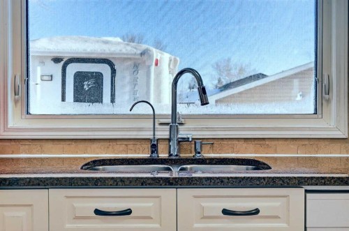 168 Midlake Boulevard Se, Calgary, AB - Indoor Photo Showing Kitchen With Double Sink