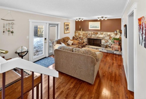 168 Midlake Boulevard Se, Calgary, AB - Indoor Photo Showing Living Room With Fireplace