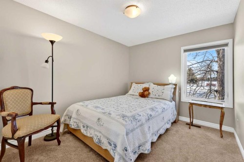 168 Midlake Boulevard Se, Calgary, AB - Indoor Photo Showing Bedroom