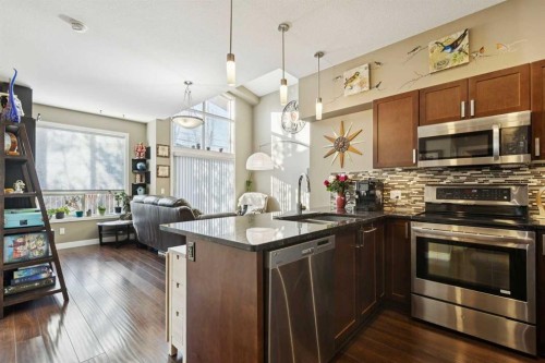 411-4303 1 Street Ne, Calgary, AB - Indoor Photo Showing Kitchen With Stainless Steel Kitchen With Upgraded Kitchen