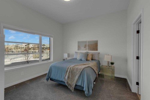 812 Reynolds Manor Sw, Airdrie, AB - Indoor Photo Showing Bedroom
