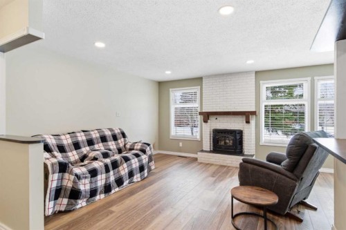 79 Templehill Drive Ne, Calgary, AB - Indoor Photo Showing Living Room With Fireplace