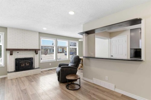 79 Templehill Drive Ne, Calgary, AB - Indoor Photo Showing Living Room With Fireplace