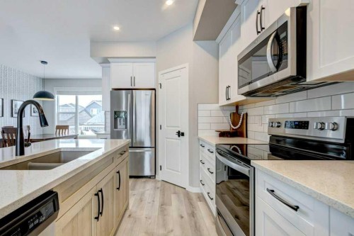 217 D'Arcy Ranch Drive, Okotoks, AB - Indoor Photo Showing Kitchen With Stainless Steel Kitchen With Double Sink With Upgraded Kitchen
