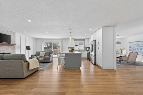 60 Sunmount Close Se, Calgary, AB - Indoor Photo Showing Living Room With Fireplace