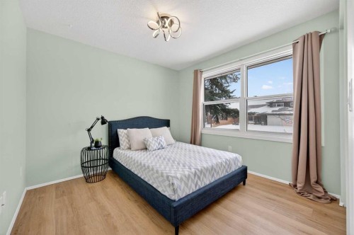60 Sunmount Close Se, Calgary, AB - Indoor Photo Showing Bedroom