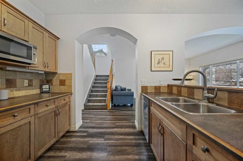 169 Panamount Green Nw, Calgary, AB - Indoor Photo Showing Kitchen With Double Sink