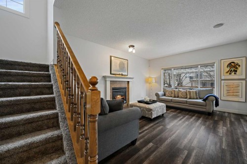 169 Panamount Green Nw, Calgary, AB - Indoor With Fireplace