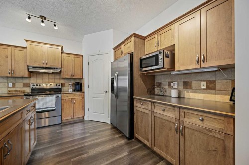169 Panamount Green Nw, Calgary, AB - Indoor Photo Showing Kitchen With Double Sink