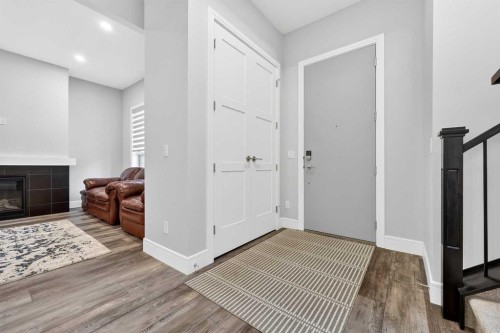 95 Rock Lake View Nw, Calgary, AB - Indoor Photo Showing Other Room With Fireplace