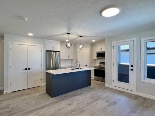 95 Rock Lake View Nw, Calgary, AB - Indoor Photo Showing Kitchen With Stainless Steel Kitchen