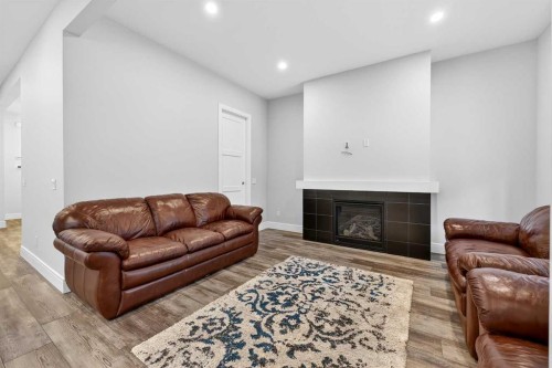 95 Rock Lake View Nw, Calgary, AB - Indoor Photo Showing Living Room With Fireplace