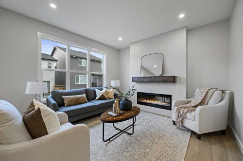 86 Versant Rise Sw, Calgary, AB - Indoor Photo Showing Living Room With Fireplace
