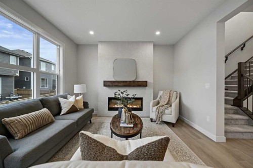86 Versant Rise Sw, Calgary, AB - Indoor Photo Showing Living Room With Fireplace