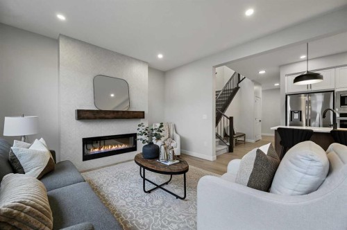 86 Versant Rise Sw, Calgary, AB - Indoor Photo Showing Living Room With Fireplace