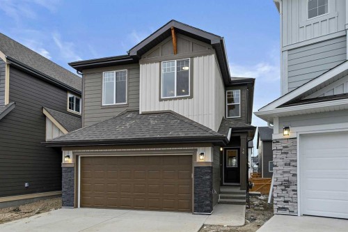 86 Versant Rise Sw, Calgary, AB - Outdoor With Facade