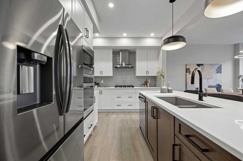 86 Versant Rise Sw, Calgary, AB - Indoor Photo Showing Kitchen With Stainless Steel Kitchen With Double Sink With Upgraded Kitchen