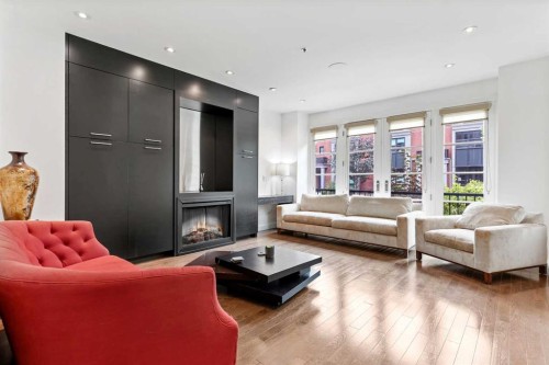 606 Aspen Meadows Hill Sw, Calgary, AB - Indoor Photo Showing Living Room With Fireplace