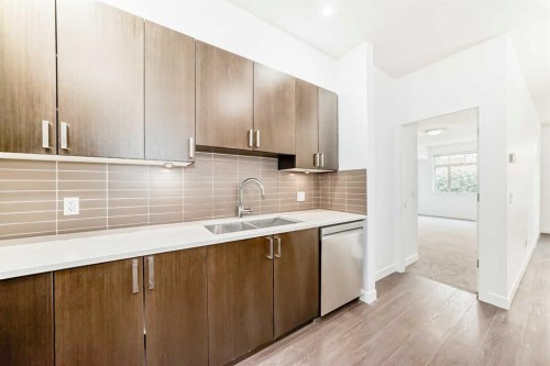 109-22 Auburn Bay Link Se, Calgary, AB - Indoor Photo Showing Kitchen With Double Sink With Upgraded Kitchen
