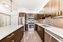 109-22 Auburn Bay Link Se, Calgary, AB  - Indoor Photo Showing Kitchen With Stainless Steel Kitchen With Double Sink With Upgraded Kitchen 