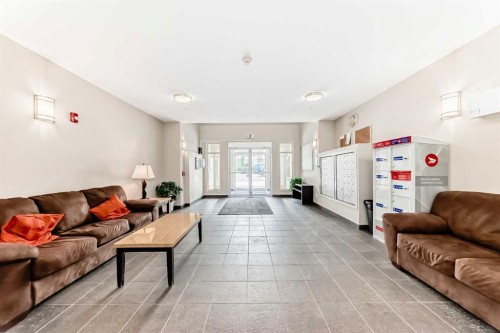 109-22 Auburn Bay Link Se, Calgary, AB - Indoor Photo Showing Living Room