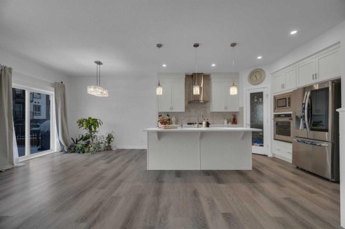 #208 Dawson Harbour Heights, Chestermere, AB - Indoor Photo Showing Kitchen With Upgraded Kitchen