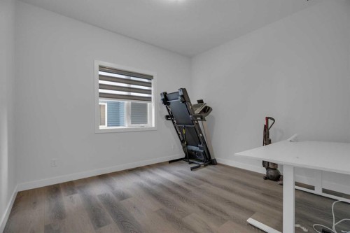 #208 Dawson Harbour Heights, Chestermere, AB - Indoor Photo Showing Gym Room