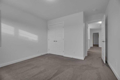 #208 Dawson Harbour Heights, Chestermere, AB - Indoor Photo Showing Other Room